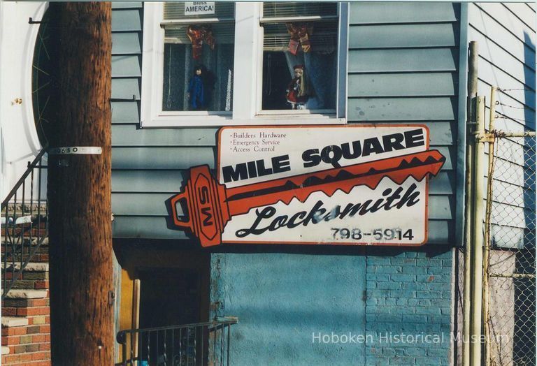 Color photo of wall sign for Mile Square Locksmith, 409 Jefferson Street, Hoboken, Jan. 3 & 4, 2002. picture number 1