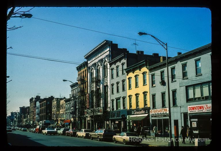 Color slide of eye-level view from the SE corner of Washington & 5th looking S at storefronts picture number 1