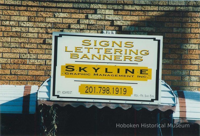 Color photo close-up of sign for Skyline Graphic Management, 601 Adams Street, Hoboken, Jan. 3 & 4, 2002. picture number 1