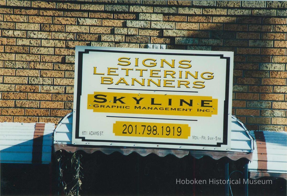 Color photo close-up of sign for Skyline Graphic Management, 601 Adams Street, Hoboken, Jan. 3 & 4, 2002. picture number 1