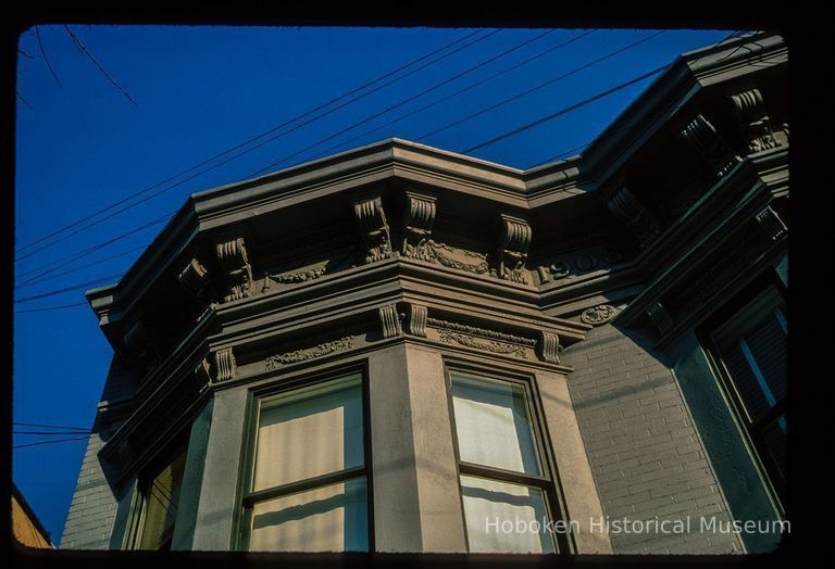 Color slide of close-up view of cornice, brackets, frieze and bay window on a building at an unidentified location picture number 1