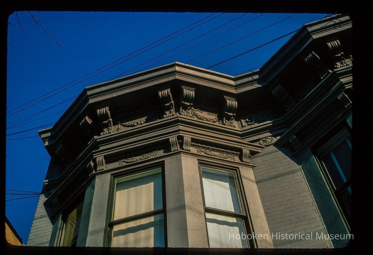 Color slide of close-up view of cornice, brackets, frieze and bay window on a building at an unidentified location picture number 1