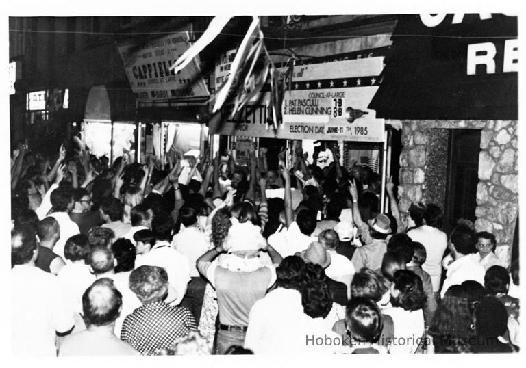 B+W photo of Tom Vezzetti supporters outside his campaign headquarters, 536 Washington St., on election night, Hoboken, [June 11, 1985]. picture number 1