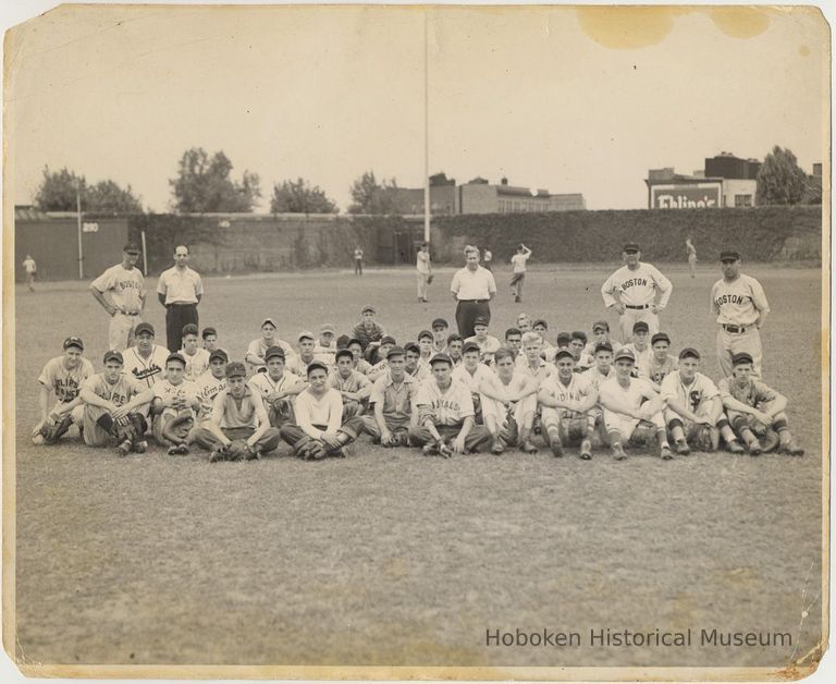 B+W photo of a large group of young baseball players posed on a ballfield, Hoboken, circa 1947-1950. picture number 1