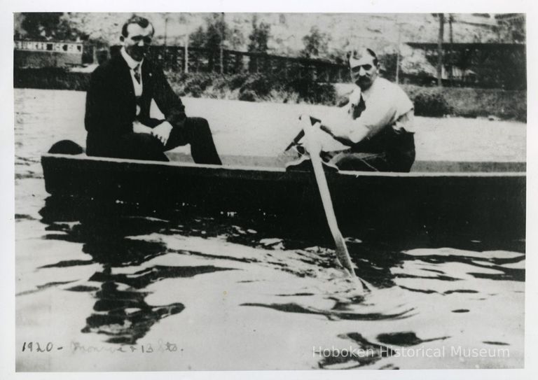 two men in rowboat near Monroe & 13th Sts., Hoboken, 1920