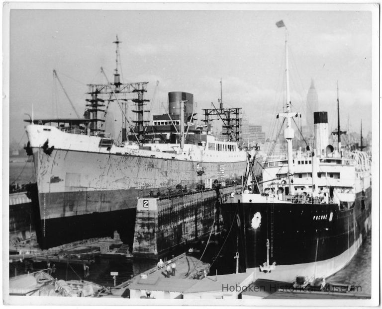 B+W photo of an unknown ship in dry dock no. 2; the S.S. Picone berthed south, Hoboken, no date, ca. 1940. picture number 1