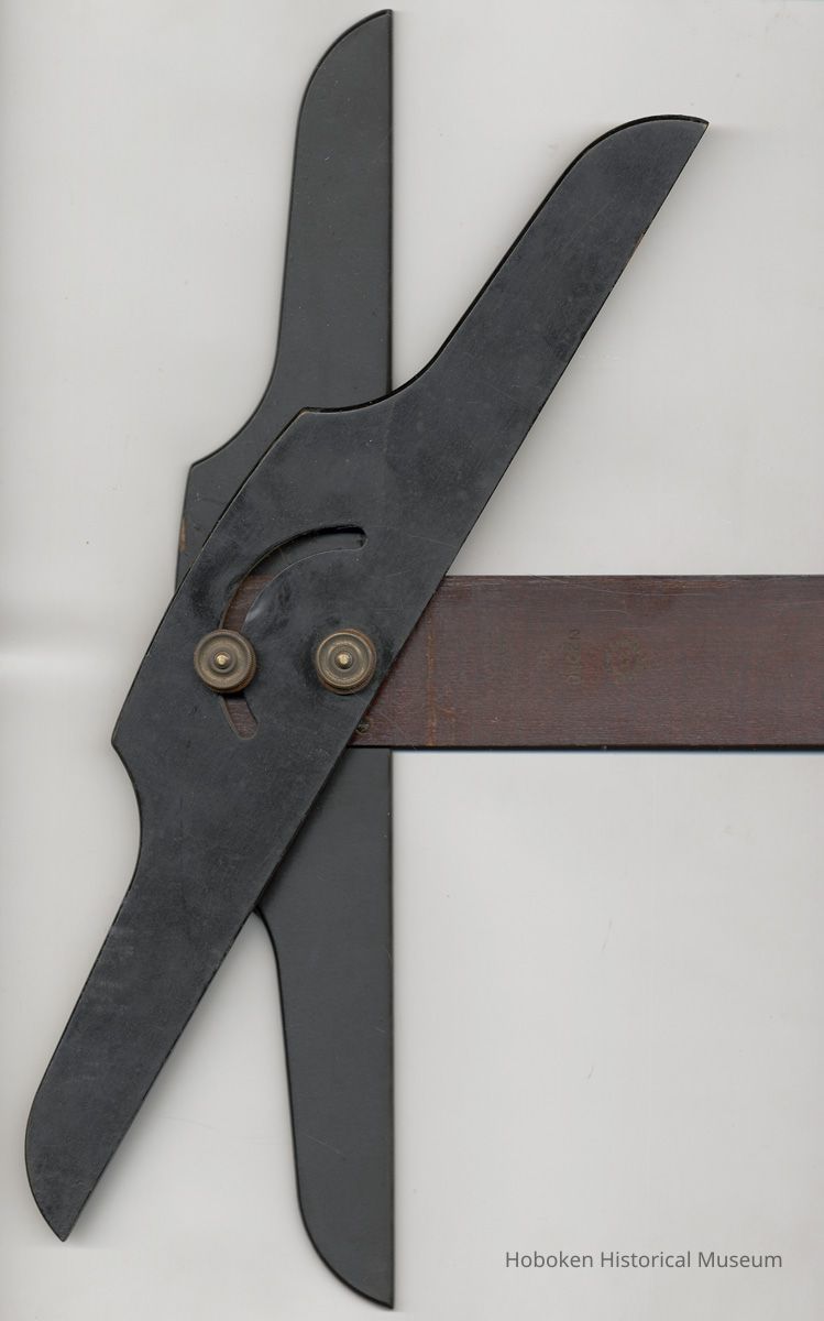 adjustable head shown at an angle; maker's marks to right.