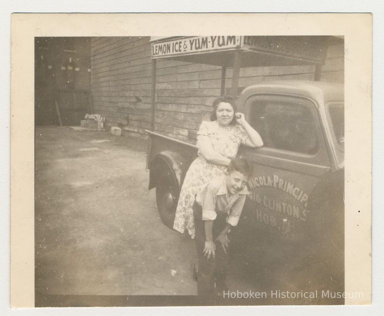 Digital image of b+w photo of a Lucy Principe & unknown boy with Lemon Ice & Yum Yum truck, 416 Clinton St., Hoboken, n.d., ca. 1950s. picture number 1