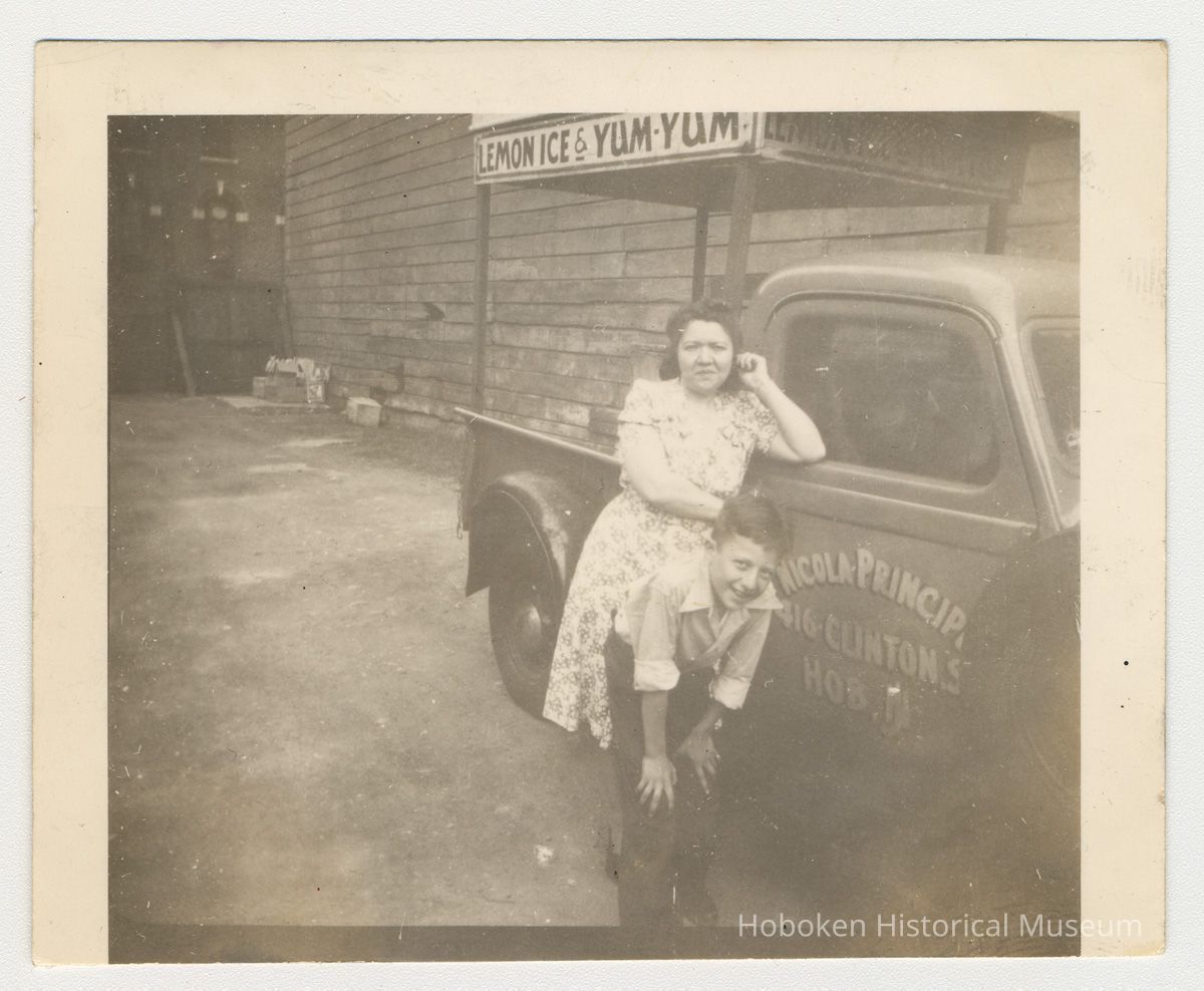 Digital image of b+w photo of a Lucy Principe & unknown boy with Lemon Ice & Yum Yum truck, 416 Clinton St., Hoboken, n.d., ca. 1950s. picture number 1