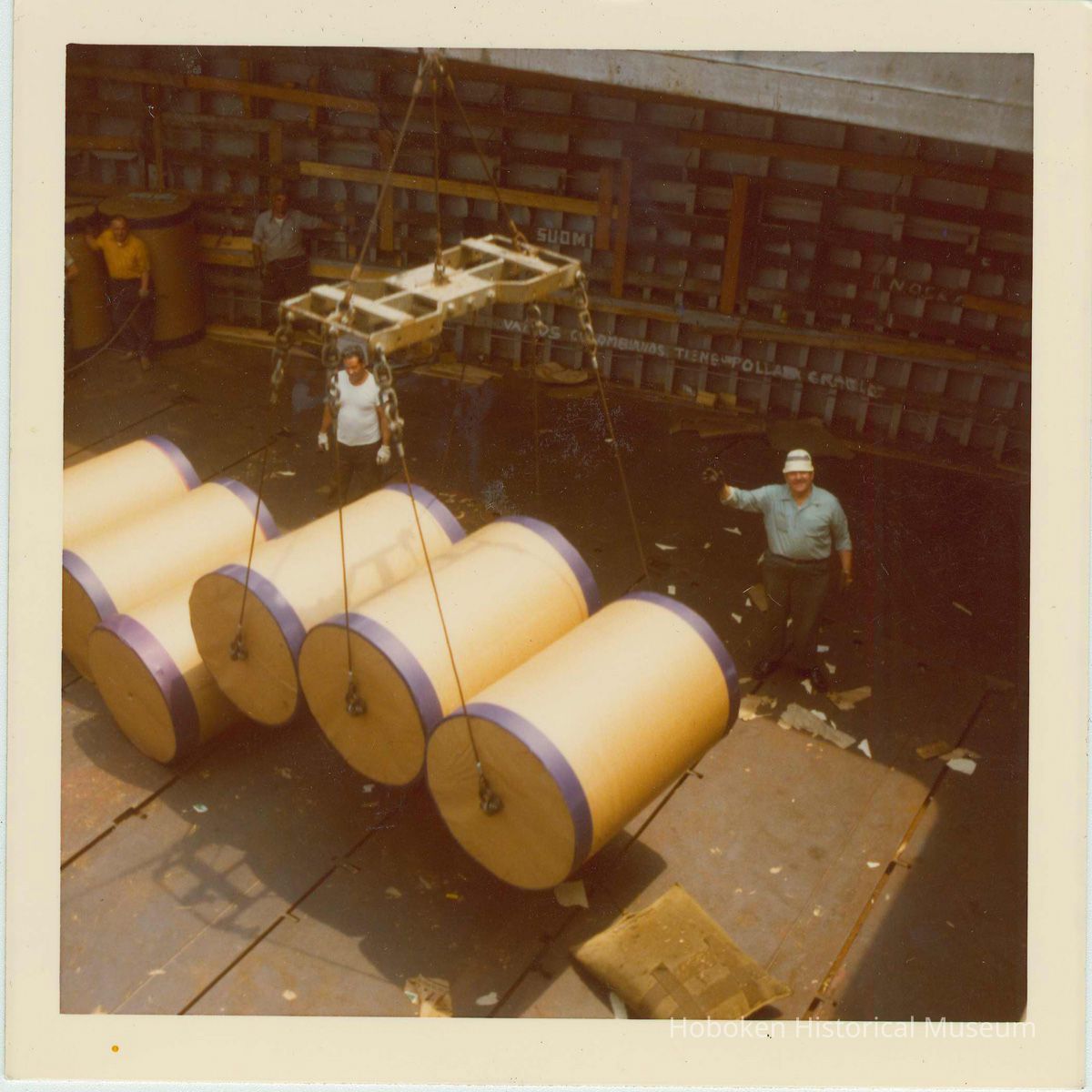 two longshoremen working in a cargo hold