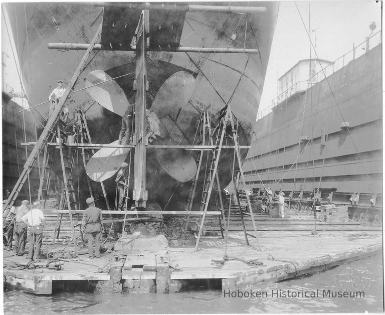 B+W photo of steerage repair to an unknown ship in a dry dock south of the Lackawanna Ferry Terminal, Hoboken, no date, ca. 1922-1930. picture number 1