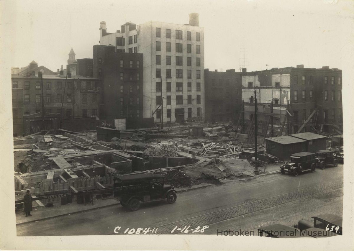 Sepia-tone photo of progress on foundation construction on the site for the Fabian Theatre, Newark & Washington Sts., Hoboken, Jan. 16, 1928. picture number 1
