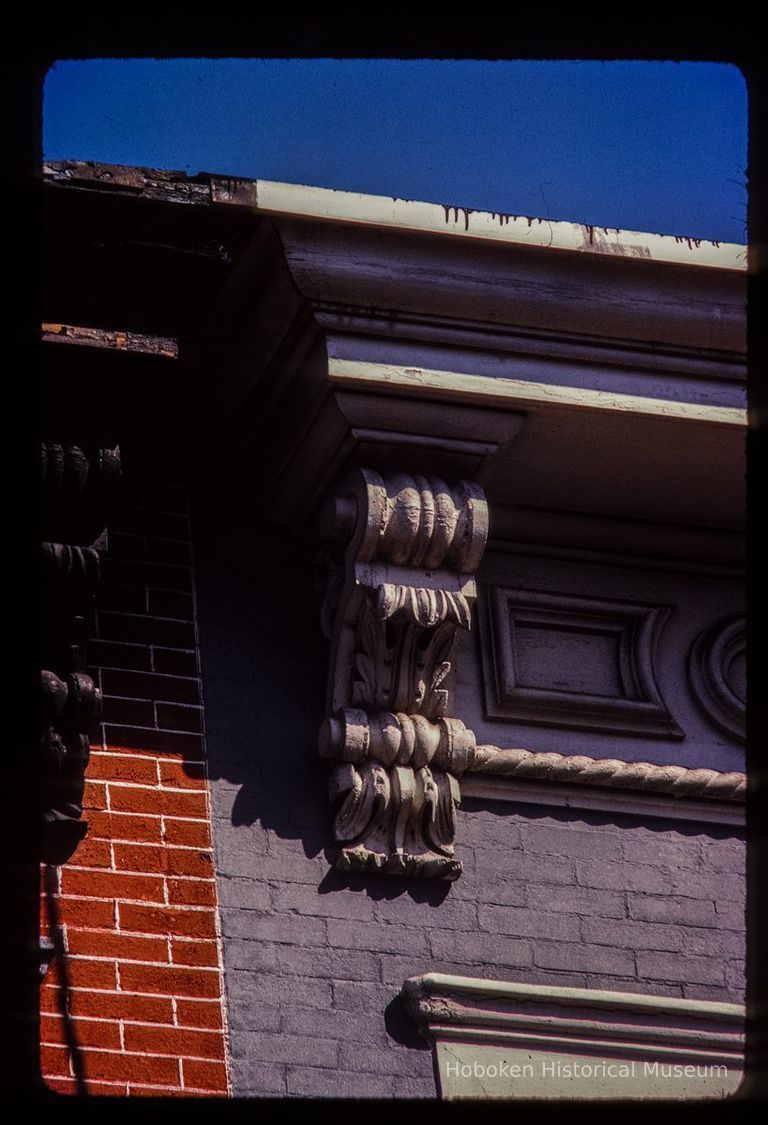 Color slide of detail view of cornices, brackets and frieze on two buildings on Bloomfield between 5th and 6th picture number 1