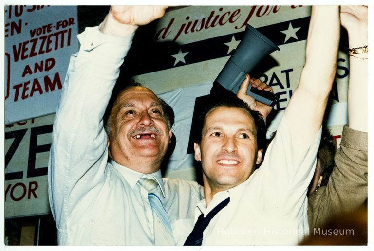 Color photo of mayoral candidate Tom Vezzetti with supporters in front of his campaign headquarters on election night, Hoboken, [June 11, 1985]. picture number 1