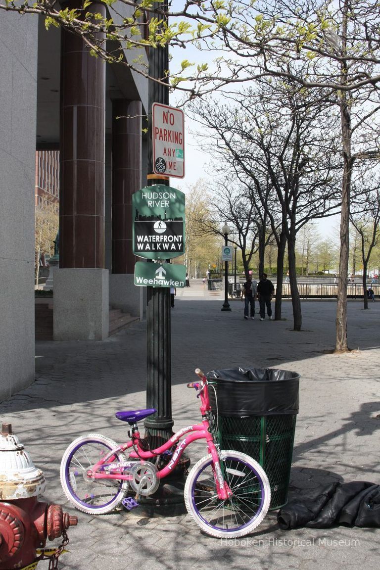 055 walkway sign on street lamp pole at Hudson Place & Warrington Plaza