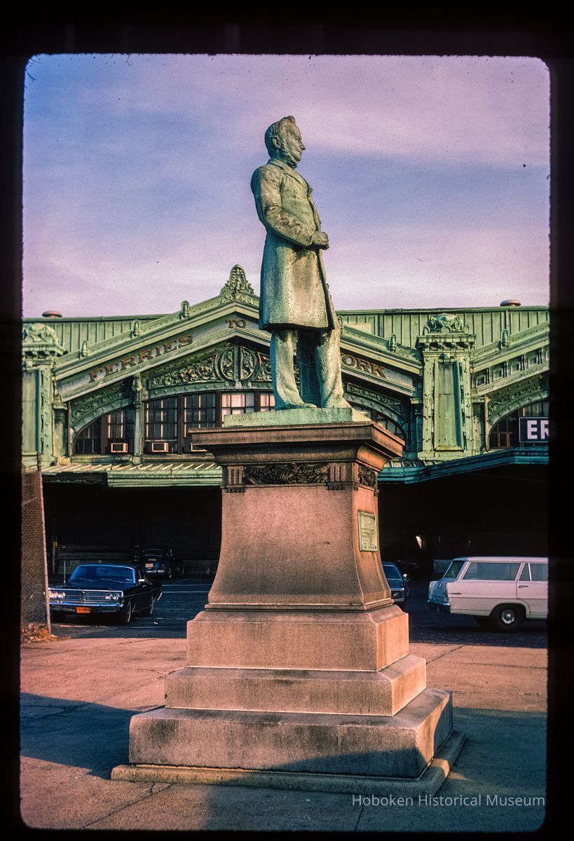 Color slide of eye-level side view of the Sam Sloane statue in front of the Lackawanna Terminal façade picture number 1