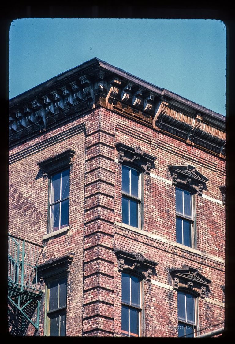 Color slide of detail view of cornice, brackets, frieze, window heads and brick quoins at 200 Washington on the NW corner with 2nd picture number 1