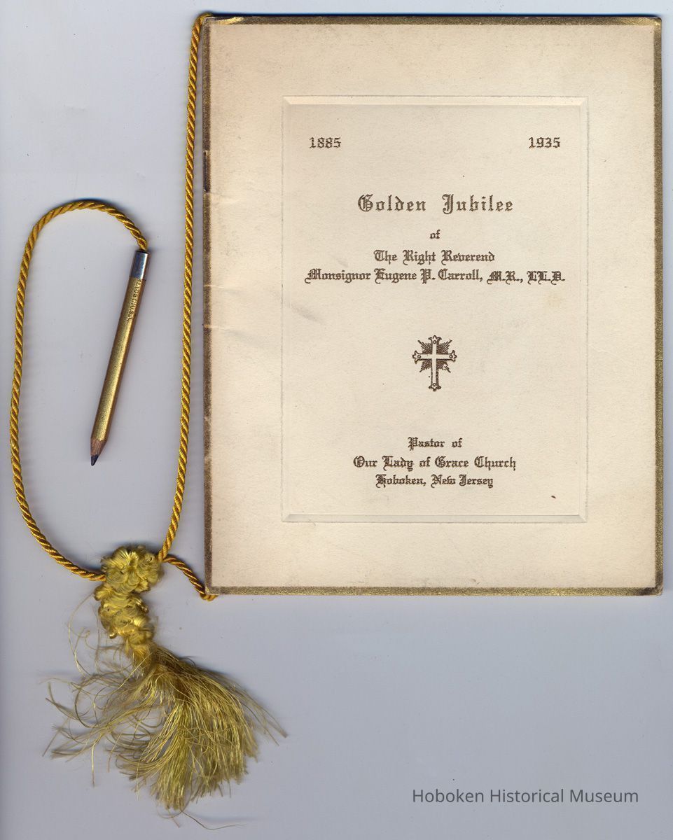view of front cover with cord, pencil & tassel