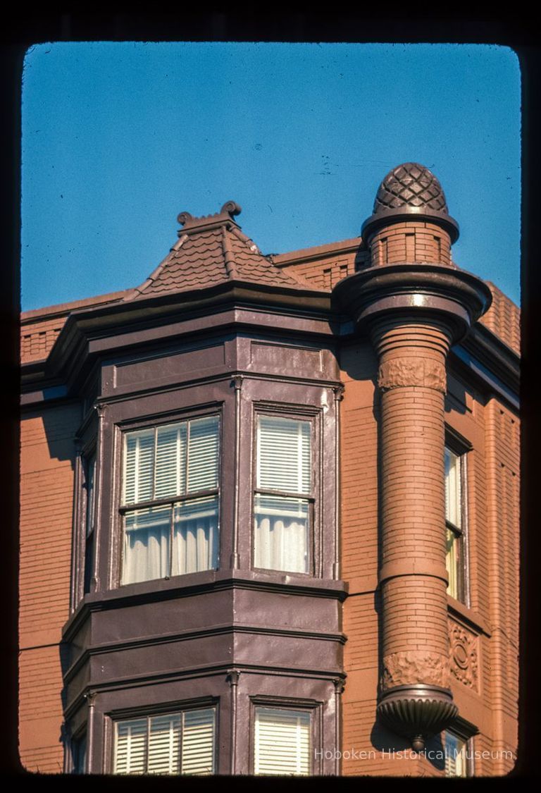 Color slide of close-up view of bay windows, brick turret and decorative tile at 801 Washington on the NE corner with 8th picture number 1