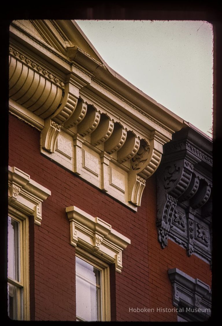 Color slide of detail view of cornice, brackets, frieze and window heads on a building between 923 and 933 Garden between 9th and 10th. picture number 1