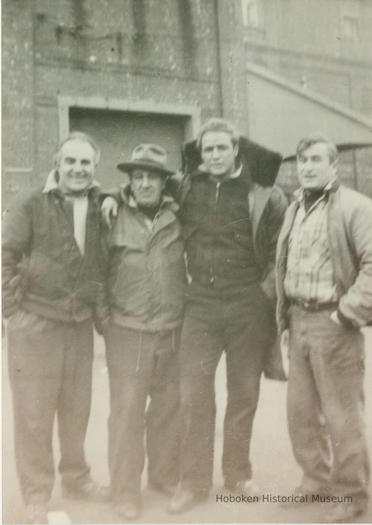 second from right: Marlon Brando; extras or character actors