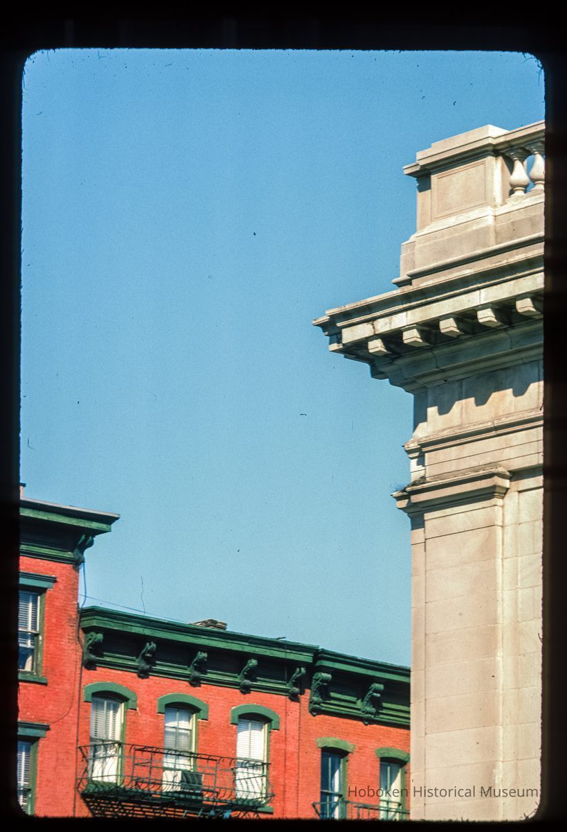 Color slide of detail view of cornices, brackets, dentils, window heads and fire escape at 44 and 47 Newark on the corner of Hudson and Newark picture number 1