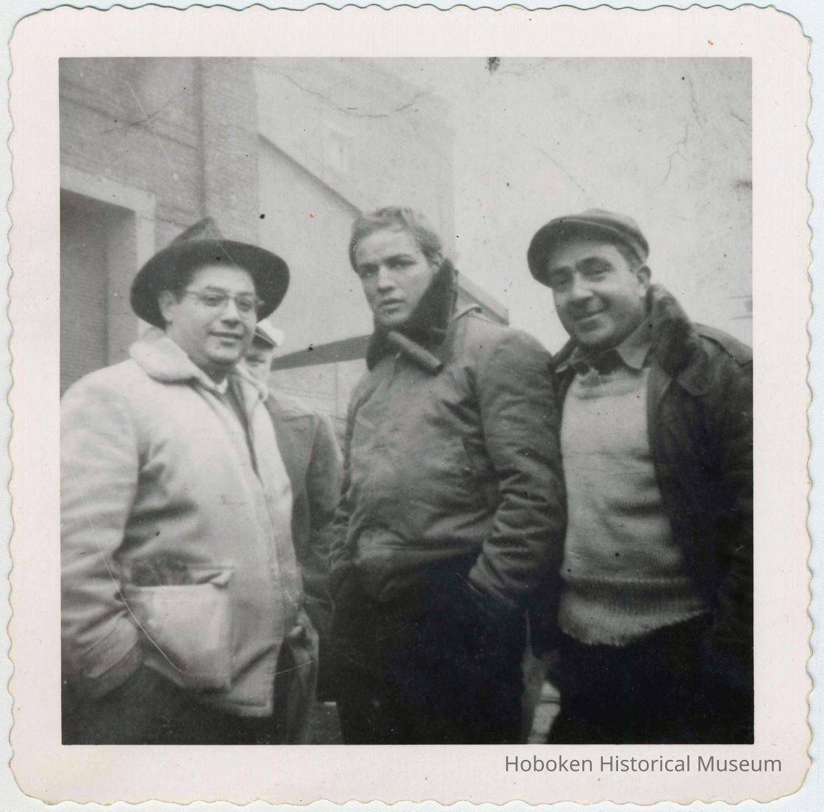 Marlon Brando (center)