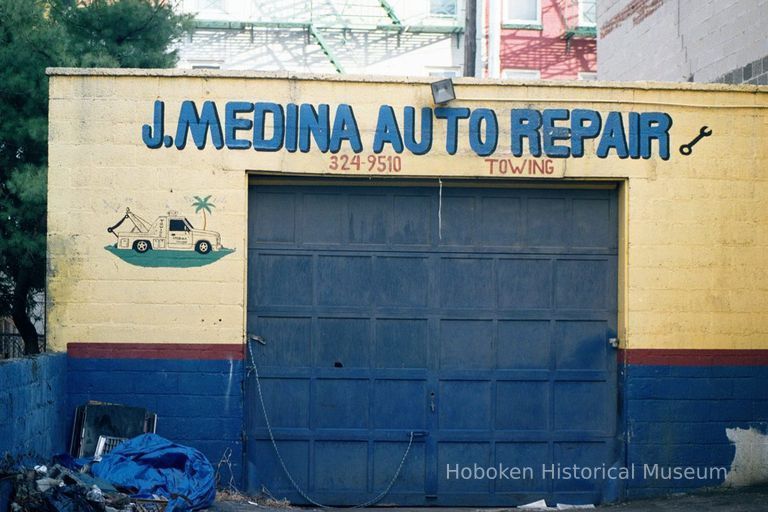 Color photo of painted sign on wall for J. Medina Auto Repair, near Jefferson and Fourth Sts., Hoboken, Jan. 3 & 4, 2002. picture number 1