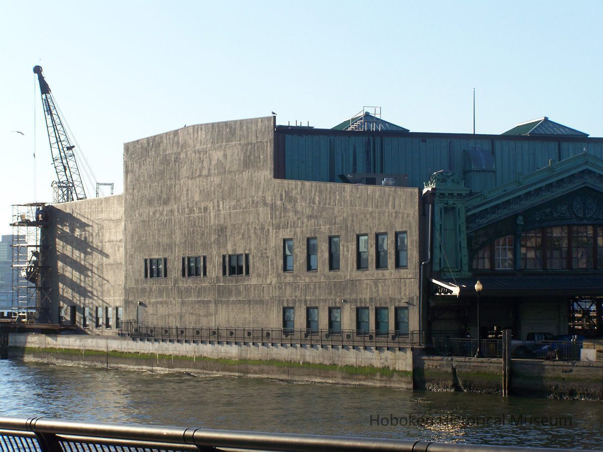 1: view southeast of north facade of ferry portion across from Pier A Park