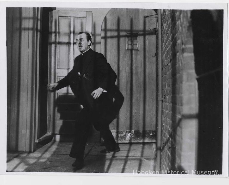 Black-and-white publicity photo of Karl Malden as Father Barry in film 