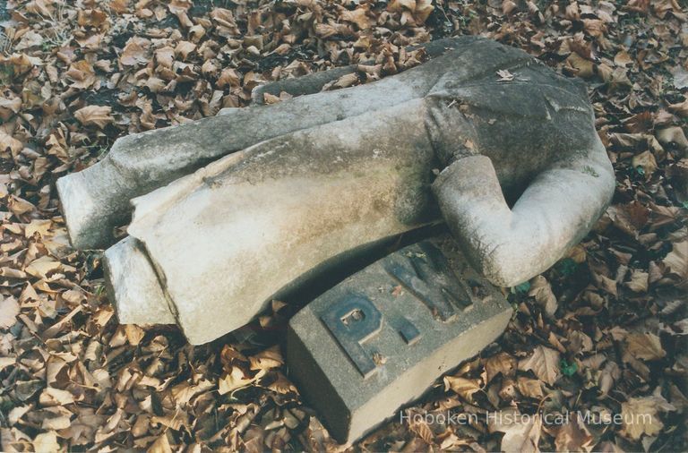 Digital image of color photo of a broken torso from the cemetery monument for Peter Woodward, Jersey City, N.J., Nov. 2002. picture number 1