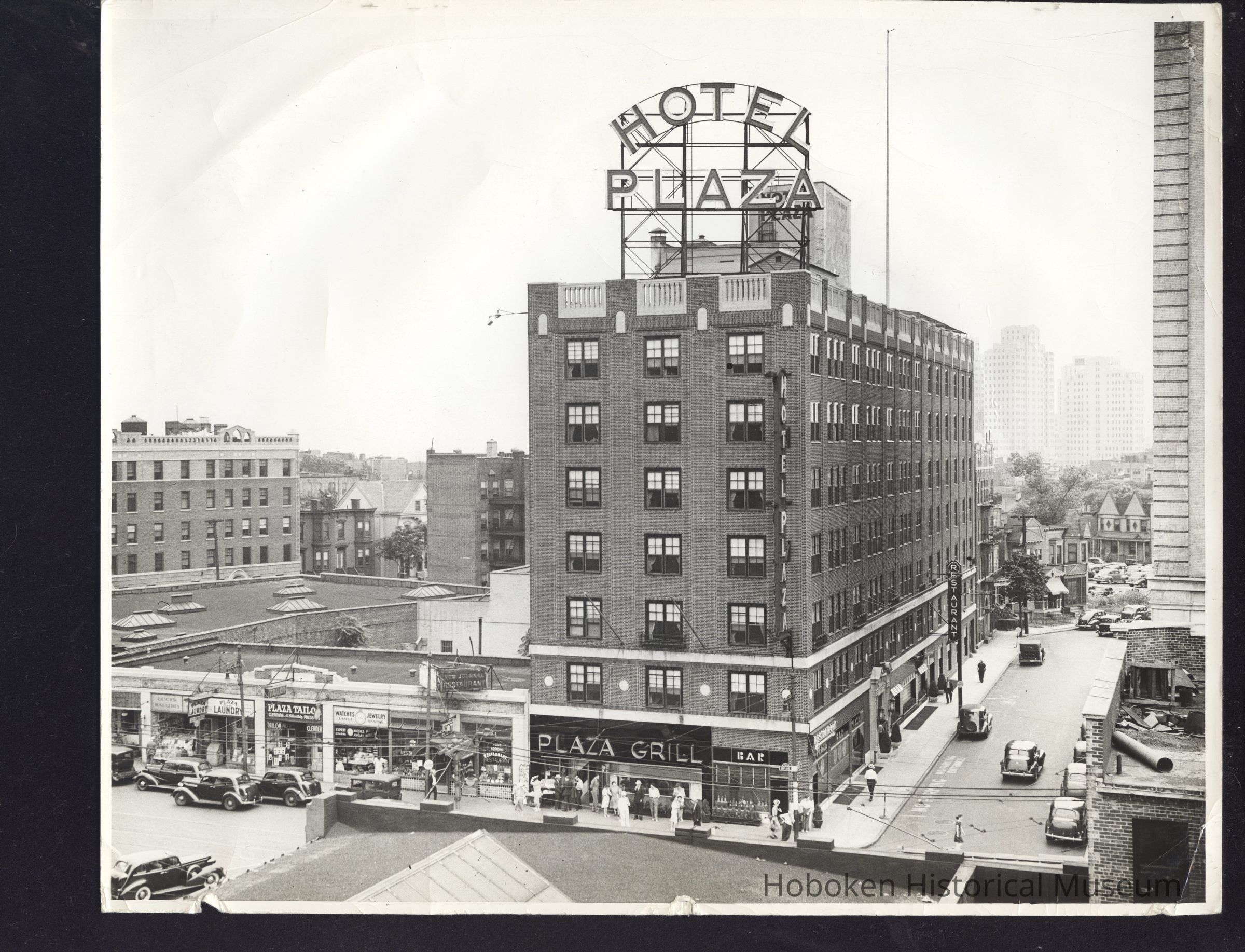 B&W photo of the mixed-use Hotel Plaza at 91 Sip Avenue, Jersey City. picture number 1