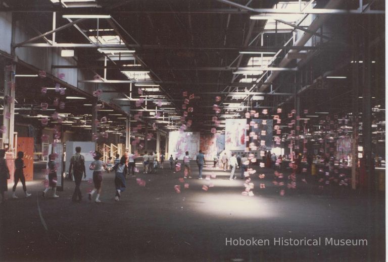 Color photo of artwork on display inside Pier C shed during Celebration '82, Hoboken, [June] 1982. picture number 1