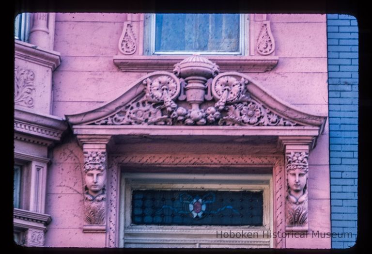 Color slide of close-up view of portico pediment, brackets and stained glass transom window at 161 12th between Bloomfield and Garden picture number 1