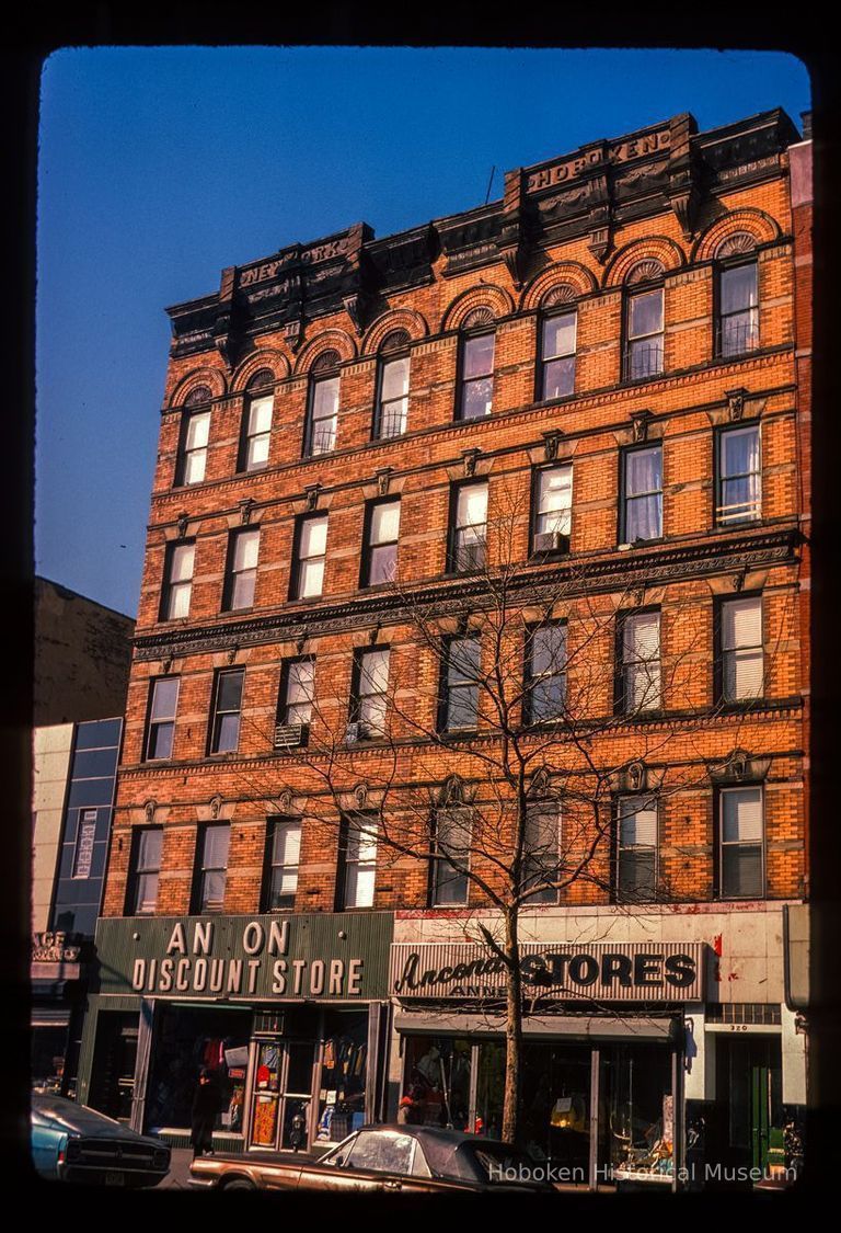 Color slide of eye-level view of façades of 318 & 320 Washington between 3rd & 4th occupied by the Ancona Discount Stores picture number 1