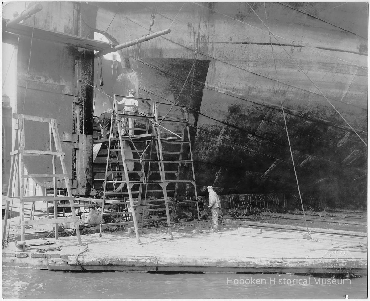B+W photo of steerage repair to an unknown ship in a dry dock south of the Lackawanna Ferry Terminal, Hoboken, no date, ca. 1922-1930. picture number 1