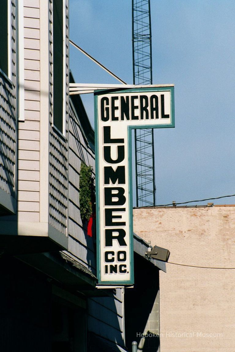 Color photo of a hanging sign for General Lumber, 204 Clinton Street, Hoboken, Jan. 3 & 4, 2002. picture number 1