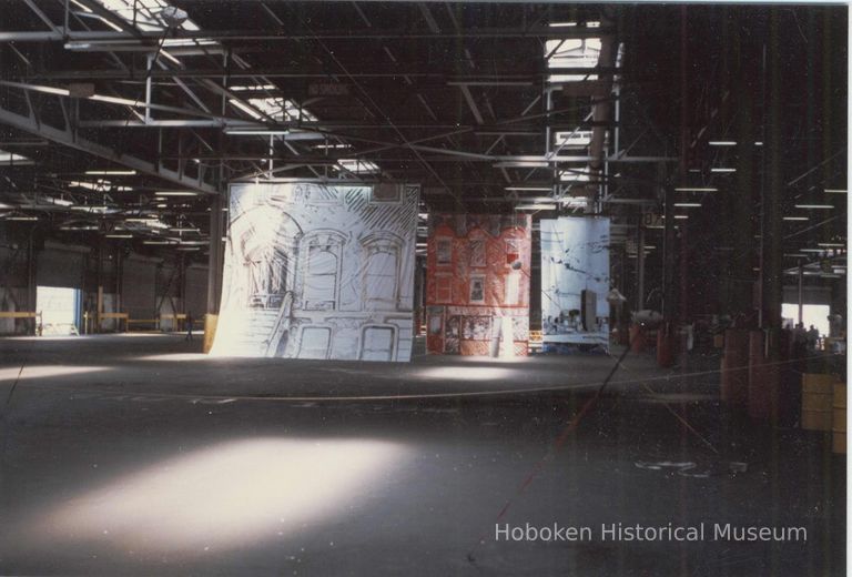 Color photo of artwork on display inside Pier C shed during Celebration '82, Hoboken, [June] 1982. picture number 1