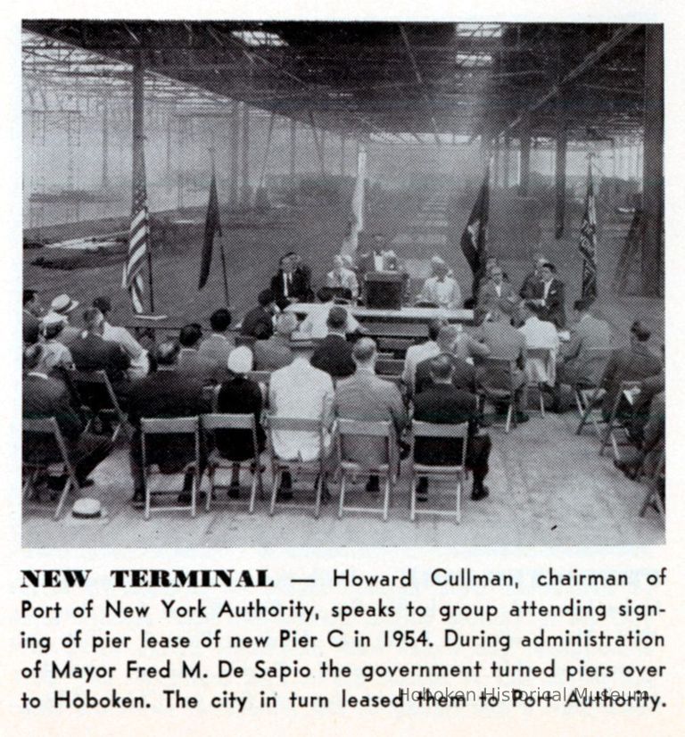 Howard Cullman of the Port of N.Y. Authority speaking to group attending the signing of lease for new Pier C, Hoboken, 1954. picture number 1