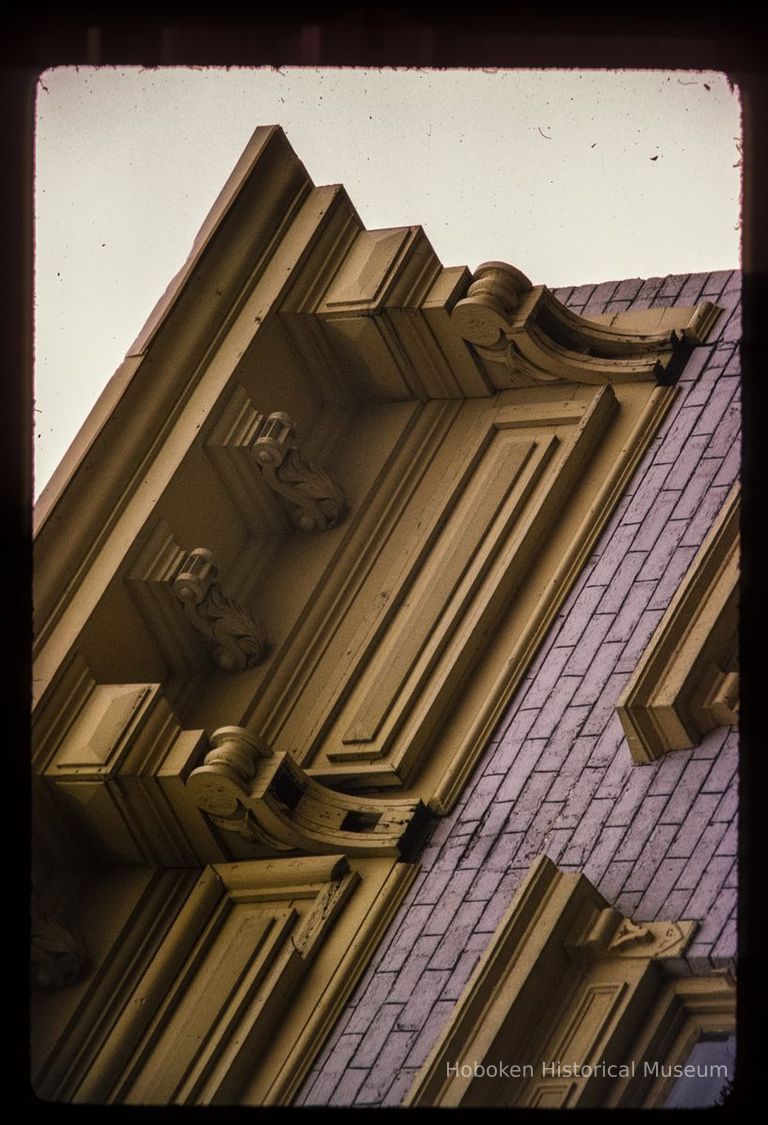 Color slide of detail view of cornice, brackets, frieze and window heads at 457 2nd between Adams and Jefferson picture number 1