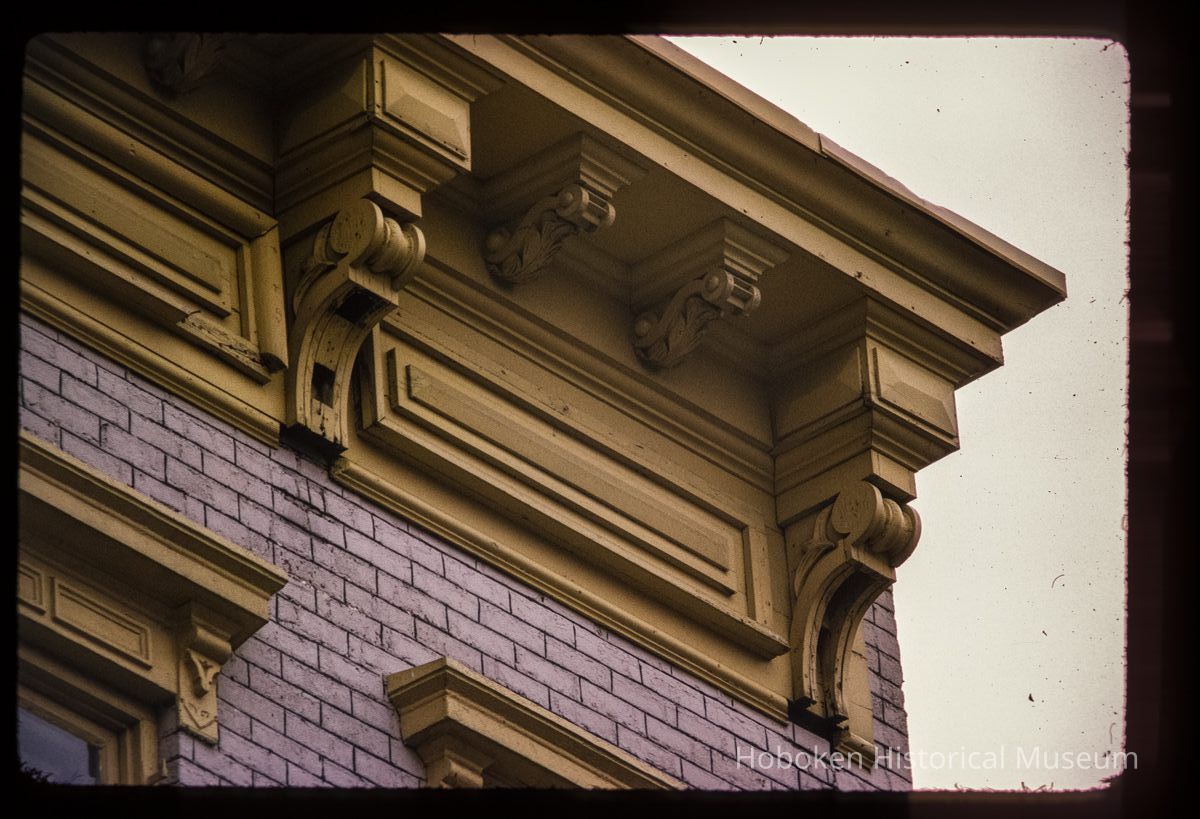 Color slide of detail view of cornice, brackets, frieze and window heads at 457 2nd between Adams and Jefferson picture number 1