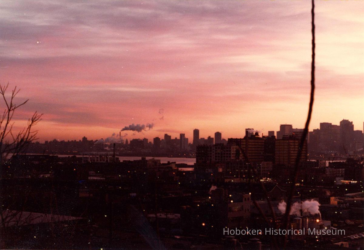 Digital scan of color photo of a sunrise view of Hoboken & Bethlehem Steel Hoboken Shipyard, Hoboken, no date, circa 1970-1980. picture number 1