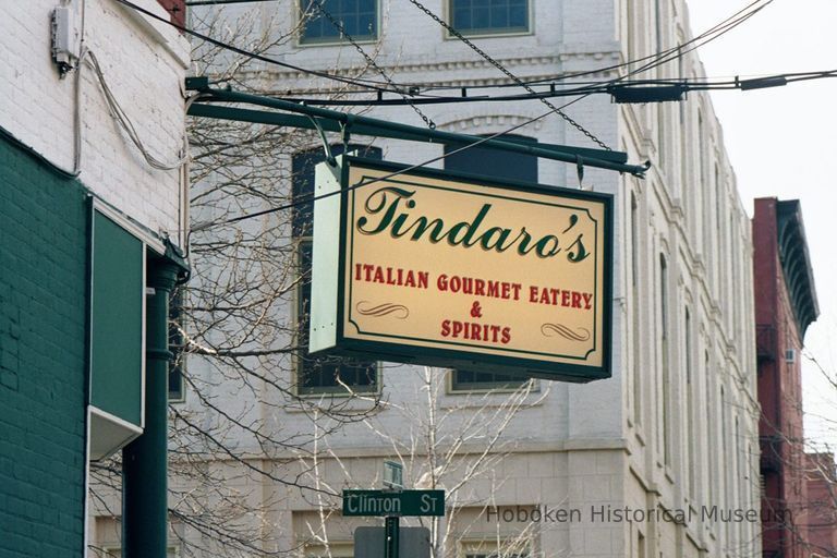 Color photo of a hanging sign for Tindaro's Italian Gourmet Eatery, 223 Clinton Street at Third St., Hoboken, Jan. 3 & 4, 2002. picture number 1