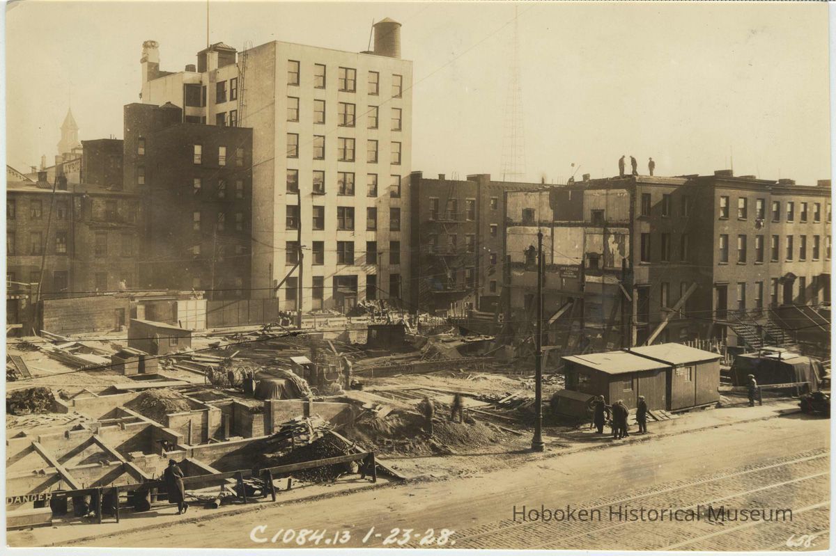 Sepia-tone photo of progress on foundation construction on the site for the Fabian Theatre, Newark & Washington Sts., Hoboken, Jan. 23, 1928. picture number 1