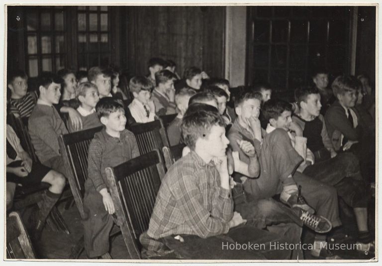 B+W photo of boys seated for program at Hoboken YMCA, Hoboken, n.d. ca, 1942-1945. picture number 1