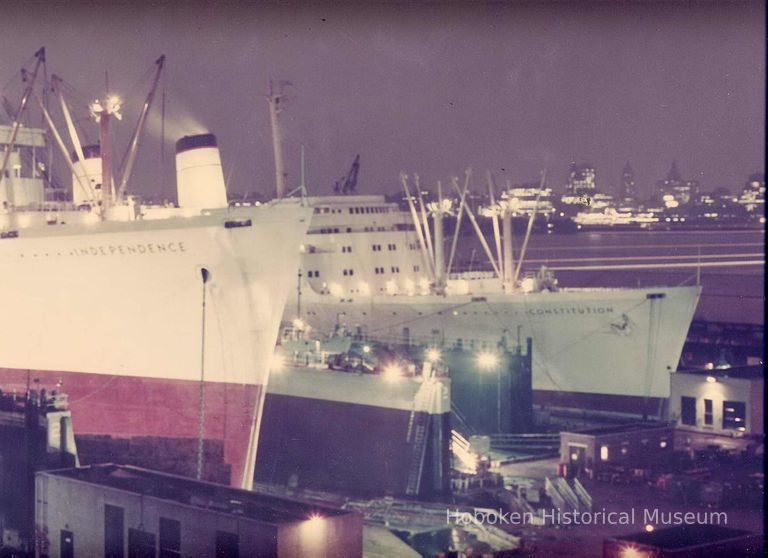 Color photo of S.S. Constitution & S.S. Independence in drydock, Hoboken Shipyard, ca. 1964. picture number 1