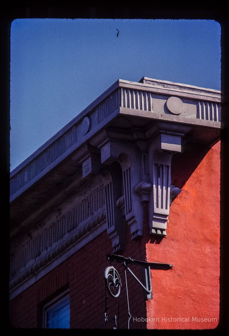 Color slide of detail view of cornice, brackets, frieze and fire escape at 155 6th between Bloomfield and Garden picture number 1