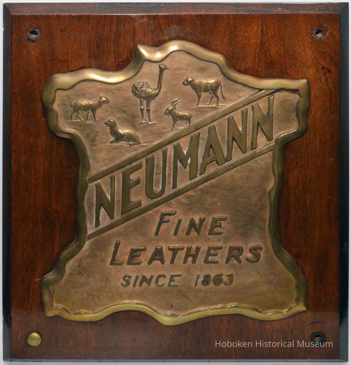 Plaque: Neumann Fine Leathers Since 1863.