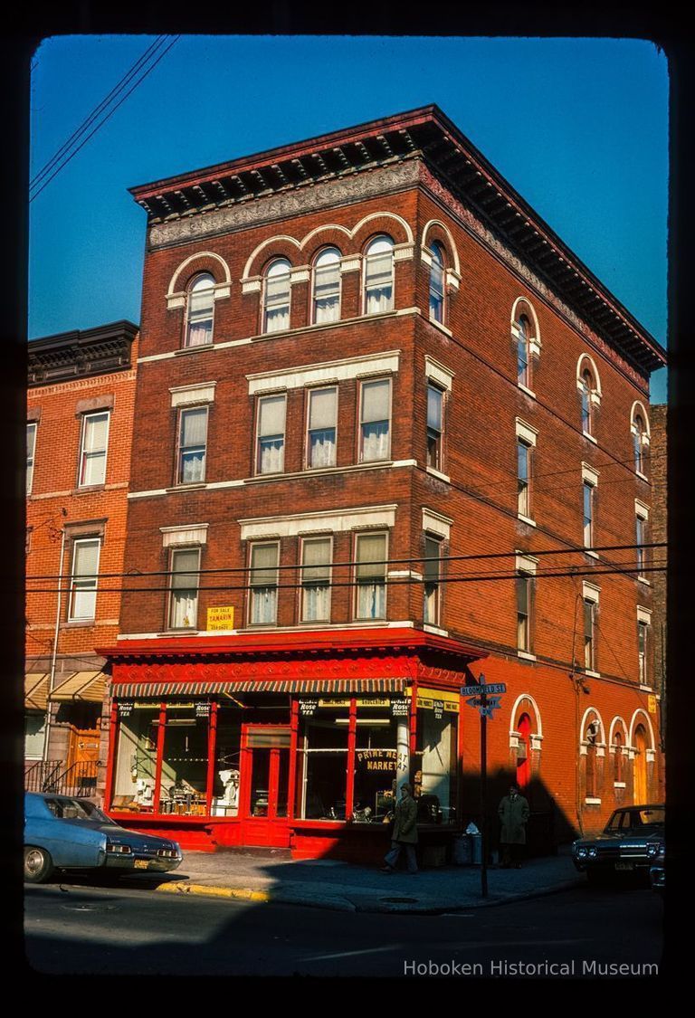 Color slide of eye-level view of front and side façades with storefront at 1001 Bloomfield on the NE corner of Bloomfield & 10th picture number 1