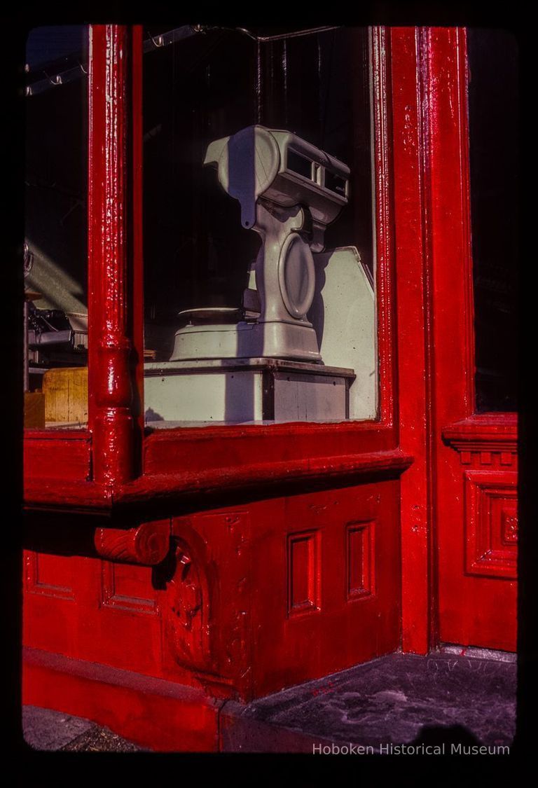 Color slide of detail view of storefront window at 1001 Bloomfield picture number 1